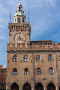 Low angle view of clock tower against sky