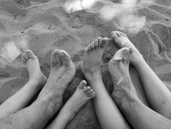 Low section of family at beach