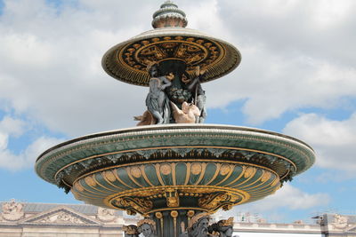 Low angle view of statue against sky