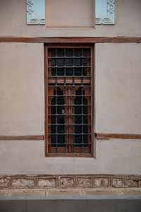 Low angle view of window on old building