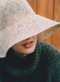 Close-up of woman wearing straw hat
