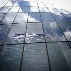 Low angle view of modern building against sky