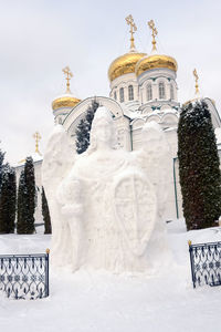 White building against sky during winter