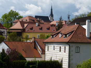 Buildings in town against sky