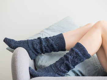 Low section of woman sitting on floor