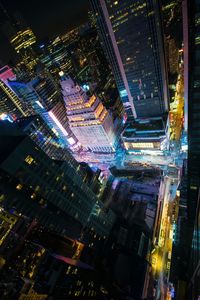 Aerial view of city lit up at night