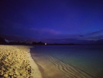 Scenic view of sea against sky at dusk