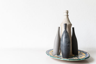 Close-up of jar against white background