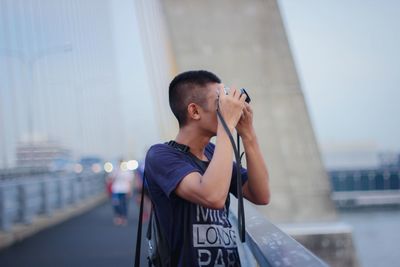 Full length of man standing on city against sky