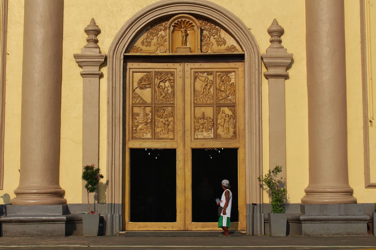 FULL LENGTH OF MAN WITH DOOR