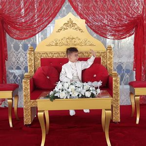 Boy sitting on chair
