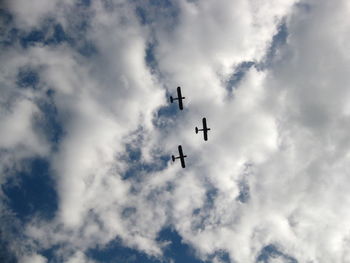 Low angle view of airplane flying in sky