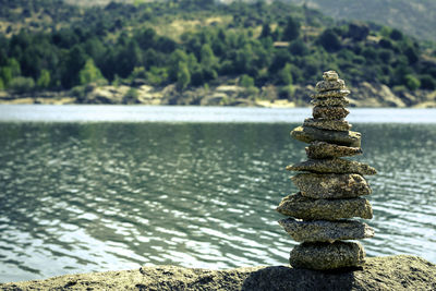 Stack of stones on rock at beach