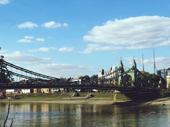 View of bridge over river in city