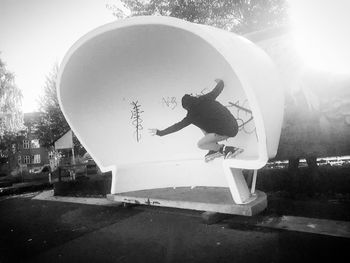 Man jumping with umbrella