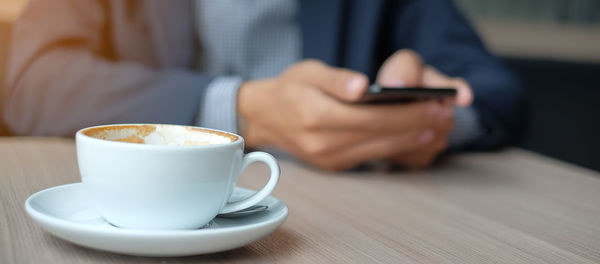 Close-up of coffee cup on table