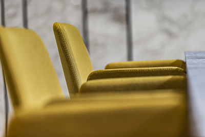 Close-up of yellow paper on table