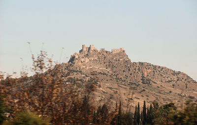 Low angle view of mountain against clear sky