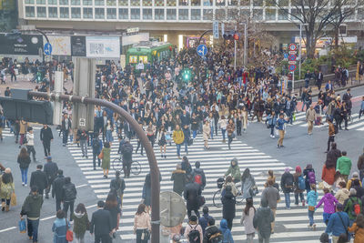 High angle view of people walking in city