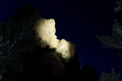 Low angle view of rocks at night