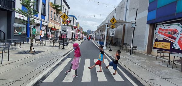 People walking on street in city