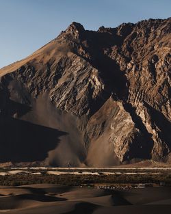 Scenic view of volcanic mountain against sky