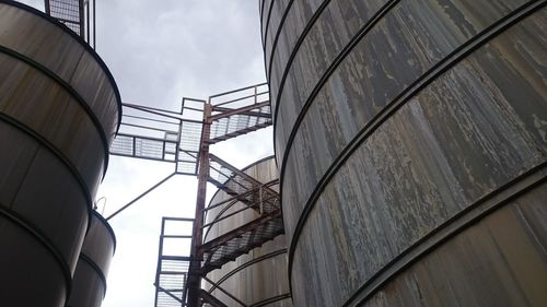 Low angle view of factory against sky