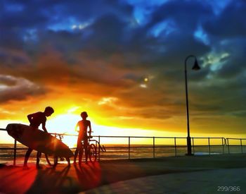 Silhouette of people at sunset