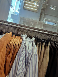 Clothes hanging in rack at store