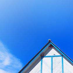 Low angle view of building on beach against sky
