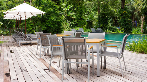 Chairs and table by water