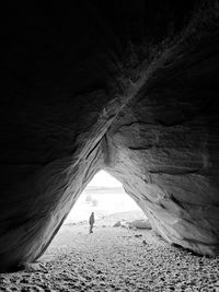 Man standing in cave