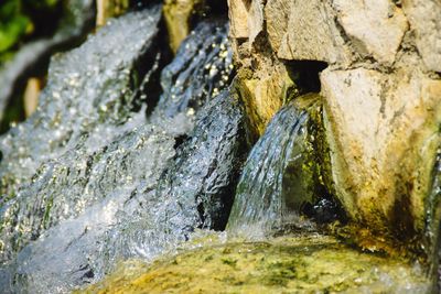 Close-up of water flowing through rocks