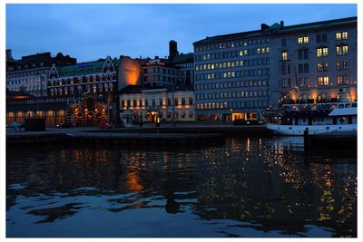 View of illuminated city at dusk