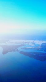 Scenic view of sea against blue sky