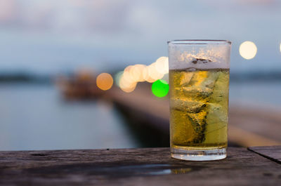 Close-up of beer glass on table