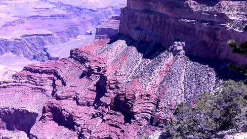 High angle view of rock formation on snow covered land