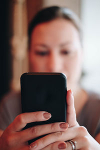 Close-up portrait of man using mobile phone