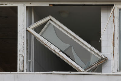 Broken windows in demolition house