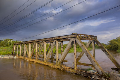 Bridge over river against sky