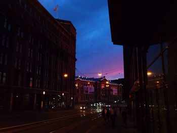 View of city street at dusk