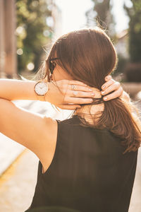 Rear view of woman wearing mask