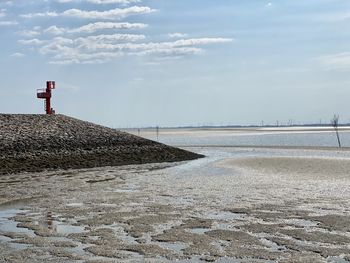 Scenic view of beach against sky