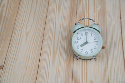 High angle view of clock on table at home