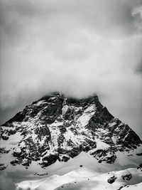 Scenic view of snowcapped mountain against sky