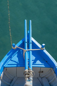 High angle view of blue boat in sea at harbor