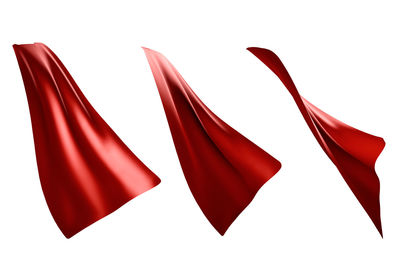 Close-up of red fabrics against white background