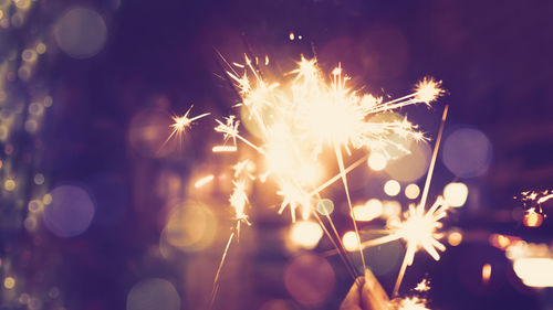 Close-up of sparklers at night
