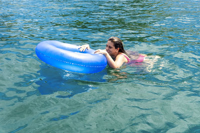 Woman swimming in sea