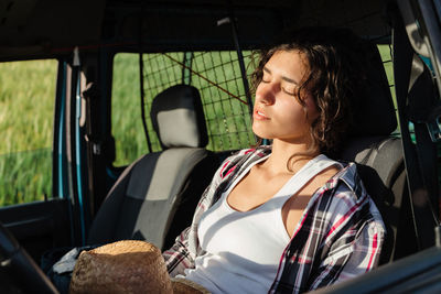 Woman sleeping in car